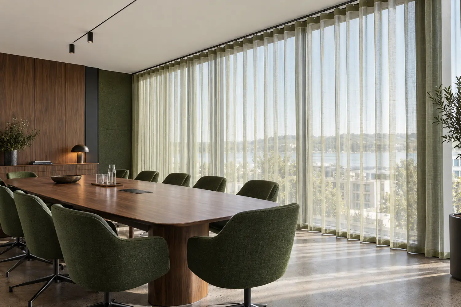 Meeting room with light curtains in wave folds on a visible surface-mounted ceiling track