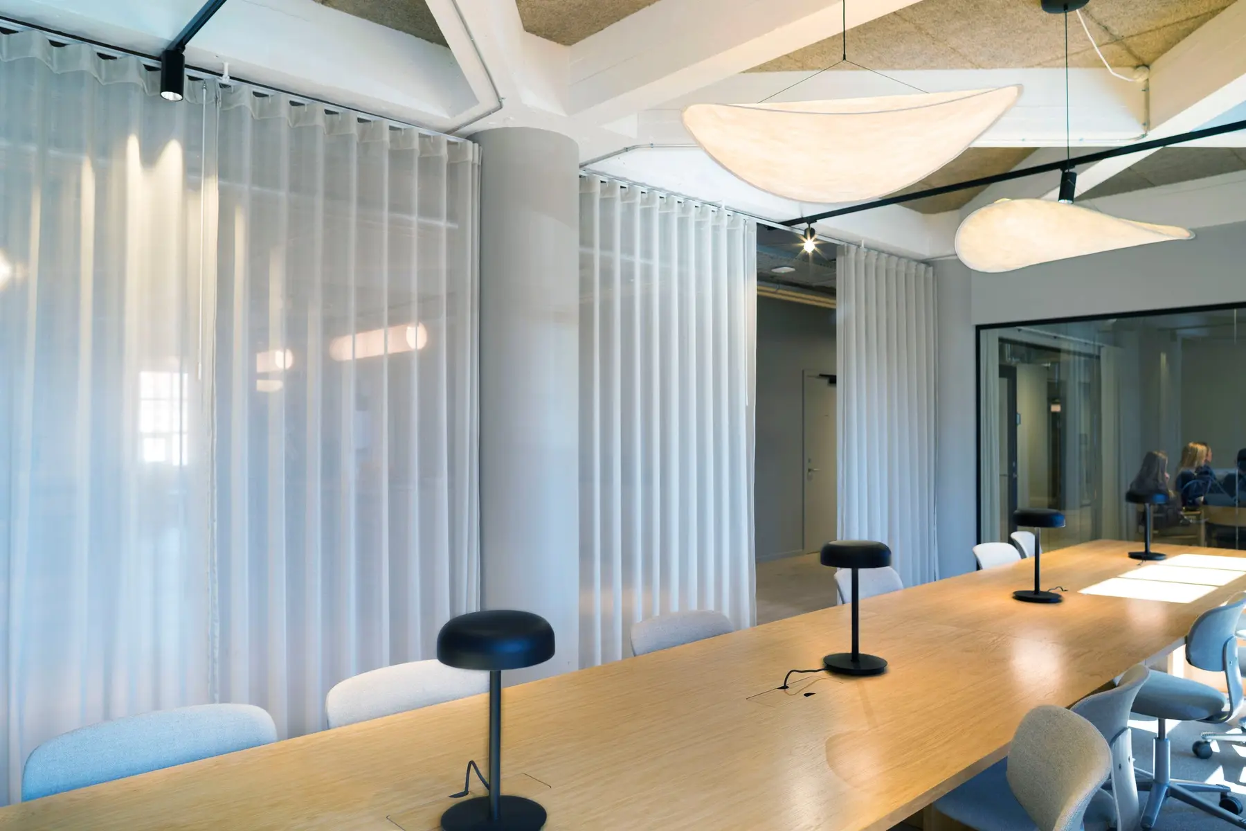 Meeting room in the Copenhagen headquarters surrounded by transparent curtains