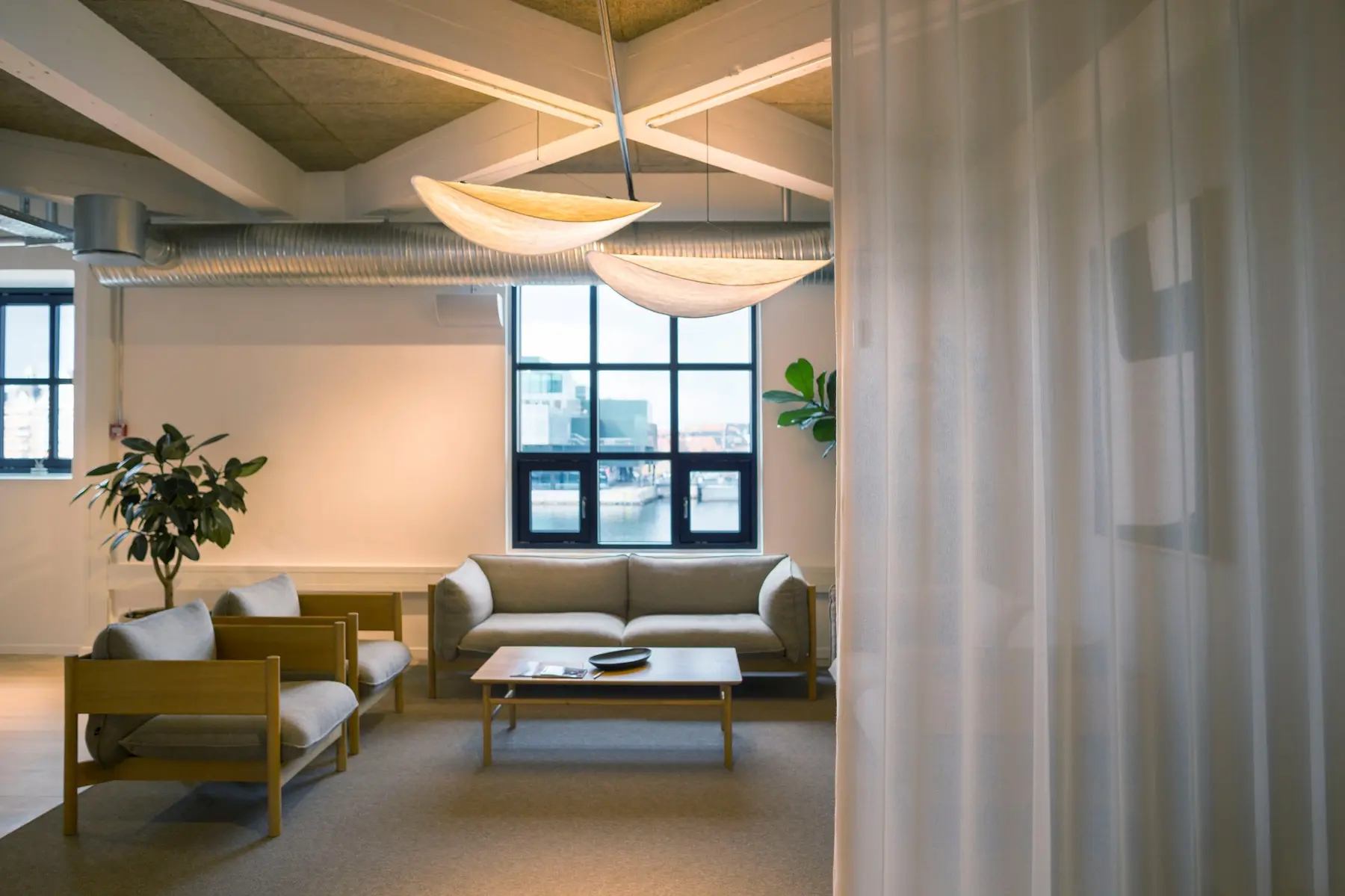 Lounge area in the Copenhagen headquarters with a curtain divider
