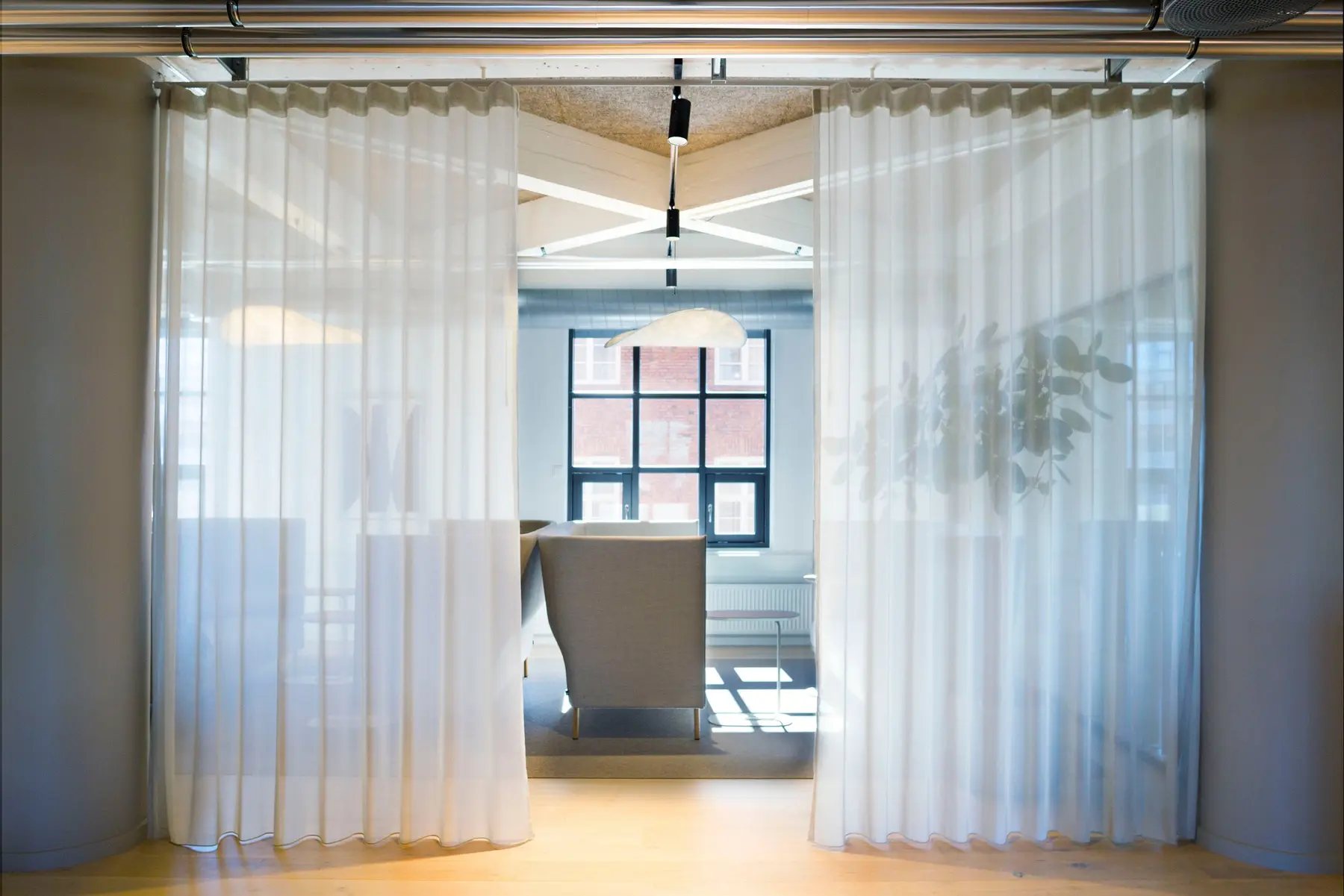 Transparent curtains between lounge zones in the Copenhagen headquarters