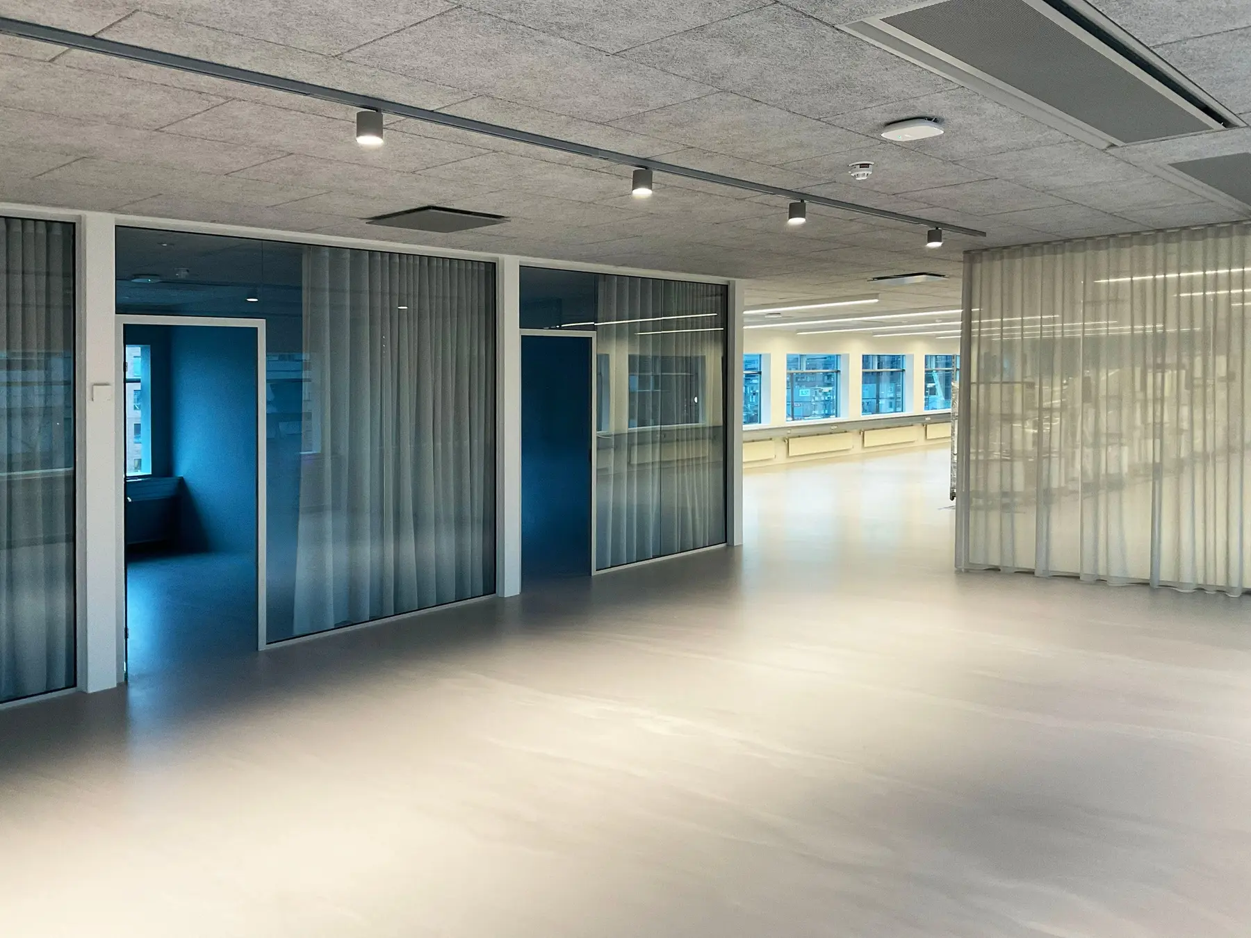 Transparent curtains used for zoning in the open Østerbro office