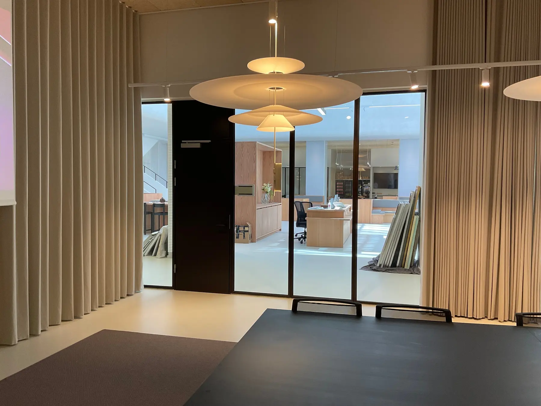 Entrance and meeting room framed by curtains on Store Kongensgade
